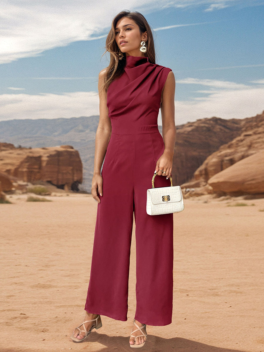 Burgundy draped neckline sleeveless wide-leg jumpsuit with a white croc-embossed handbag.
