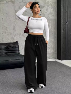 Black drawstring wide-leg maternity pants with pockets.