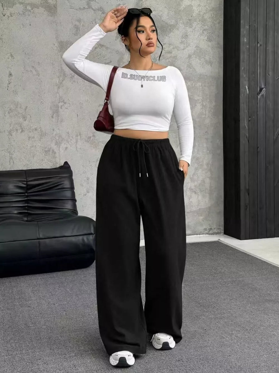 Black drawstring wide-leg maternity pants with pockets.