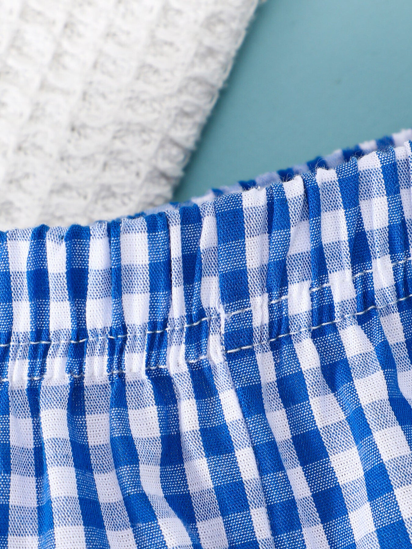 Baby blue gingham bow shorts with elastic waistband detail
