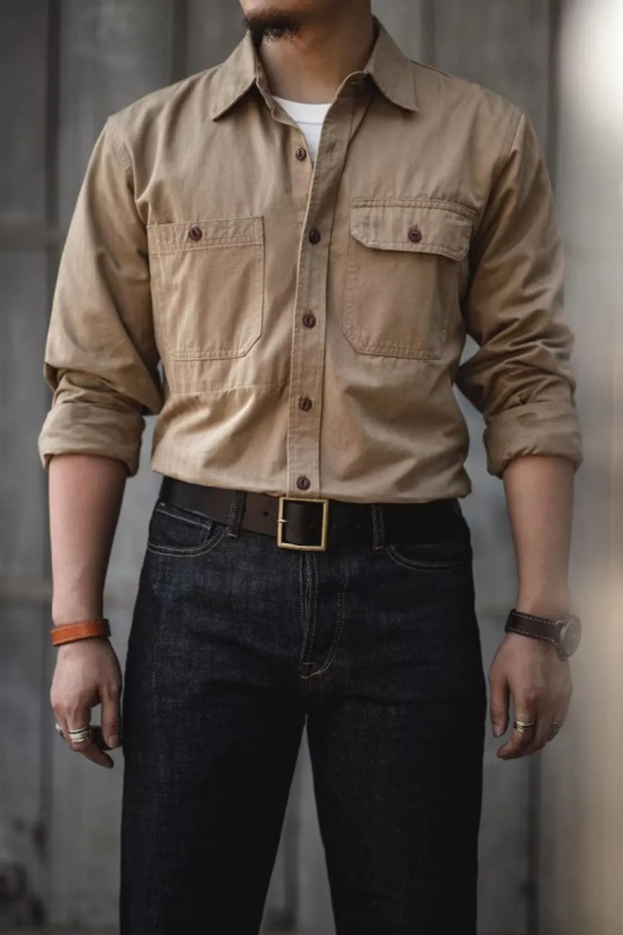 Khaki cotton twill utility shirt with two chest pockets and button front.