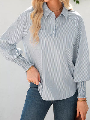 Striped collared shirt with balloon sleeves and smocked cuffs.