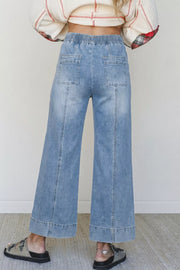 light blue wide-leg jeans with ankle-length and drawstring