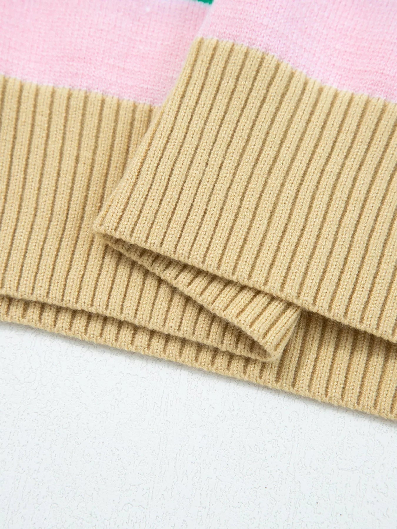 Ribbed cropped sweater in multicolor with tan ribbed cuffs and neckline detail