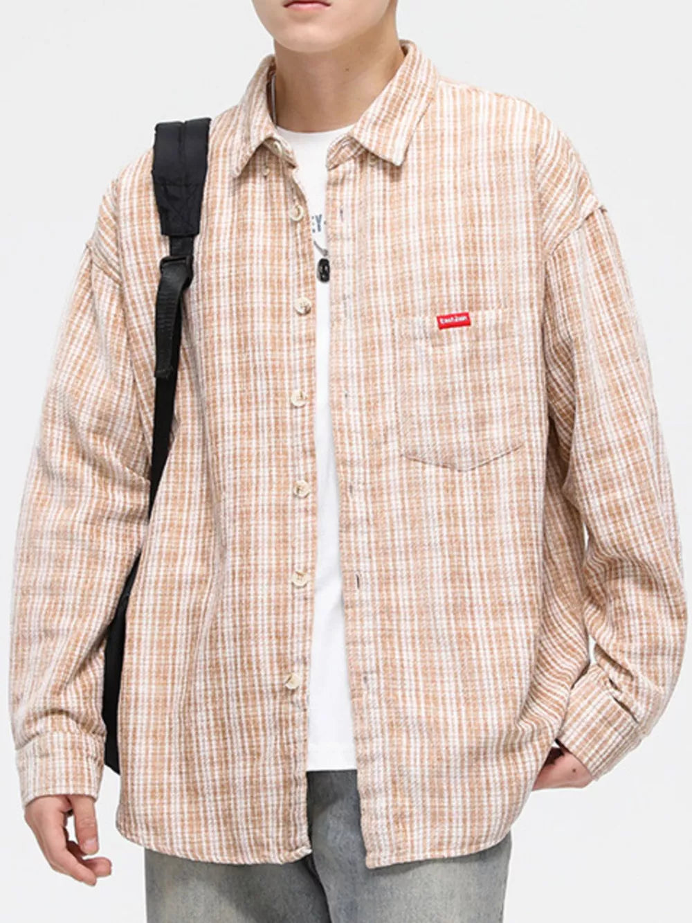 Men's classic plaid button-up shirt in beige with chest pocket.