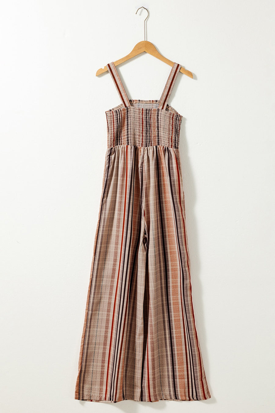 Striped square neck wide-leg romper with smocked bodice and adjustable straps.