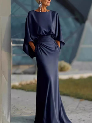 Navy batwing sleeve maxi dress with ruched waist detail and pockets.