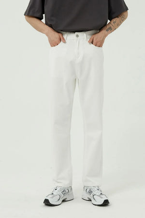 Relaxed fit ivory denim trousers with a straight leg and button fly.