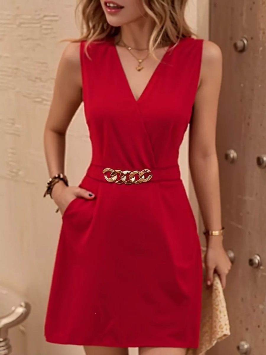 Red V-neck mini dress with gold chain belt and pockets