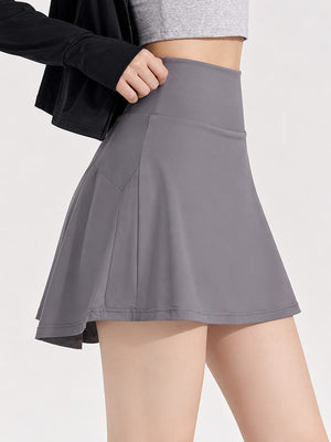 88% nylon, 12% spandex pleated skirt in White with flared silhouette