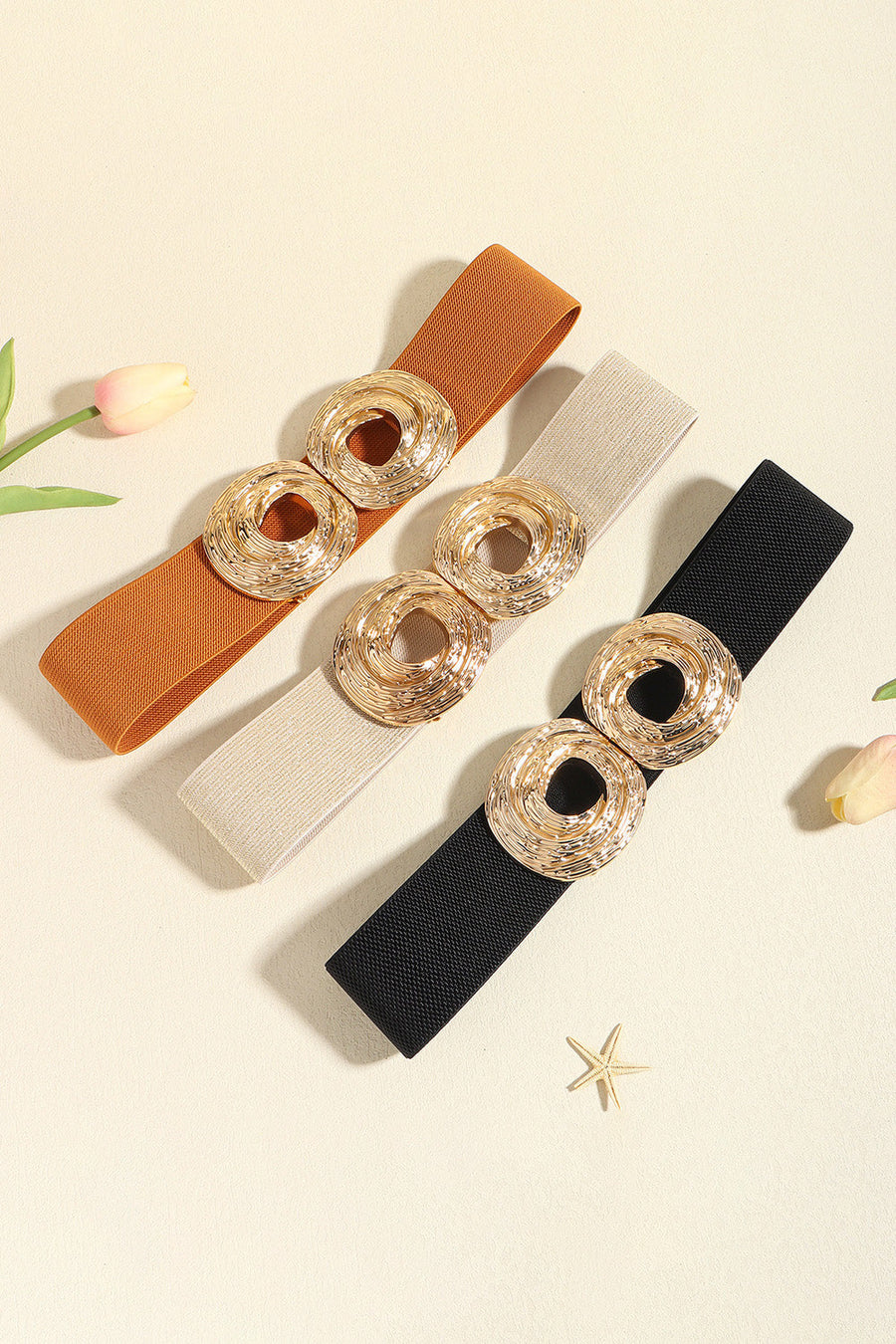 Elastic belt in black, caramel, and beige with sculptural gold alloy buckle detail