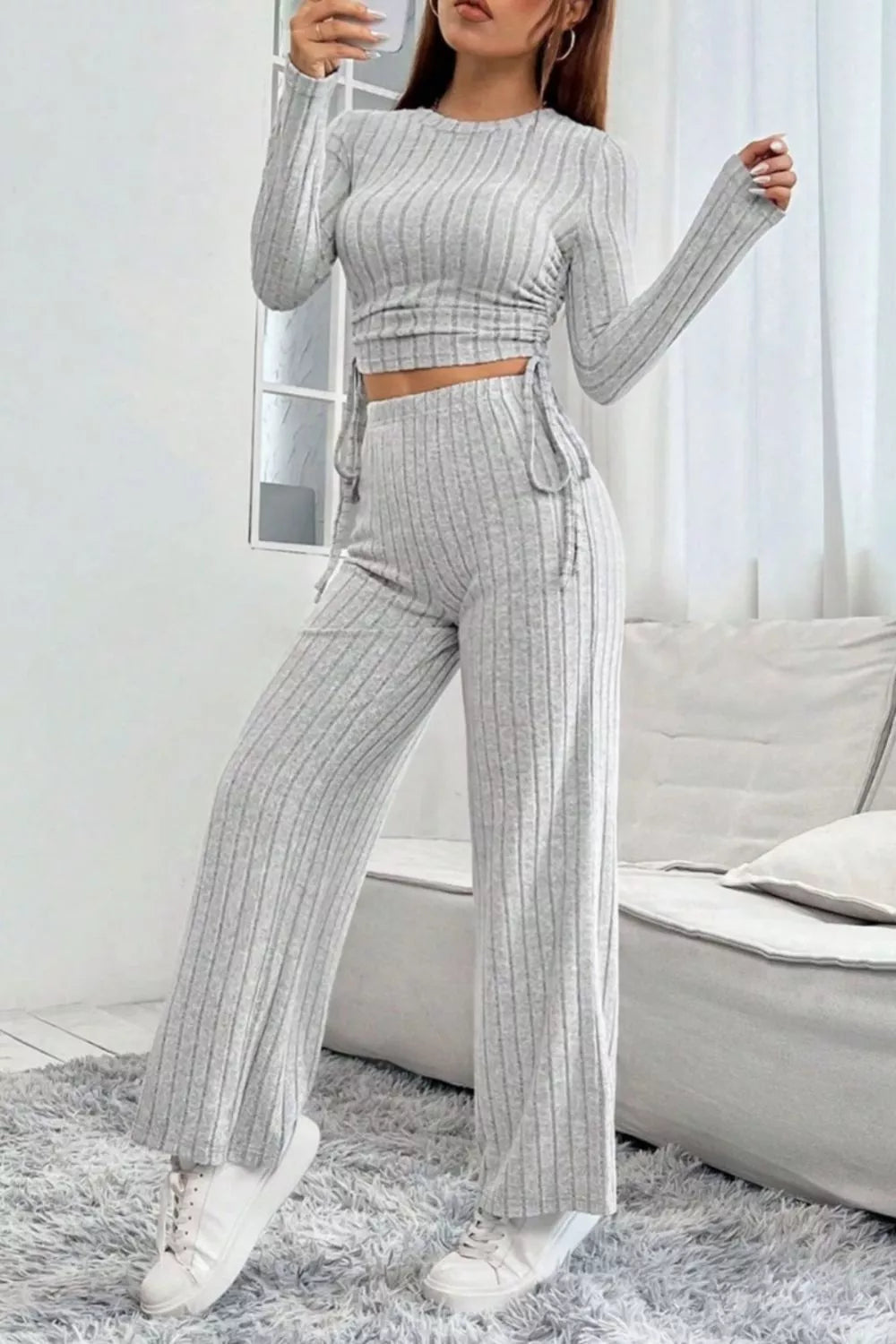 Light gray ribbed knit crop top and wide-leg pants set with drawstring details.