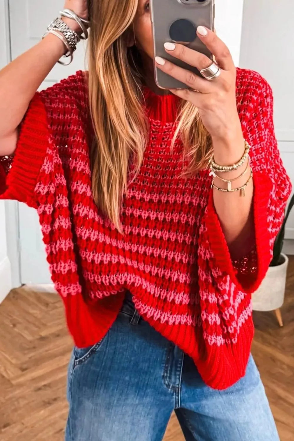 Red acrylic crew neck sweater with pink striped crochet detail and wide sleeves.
