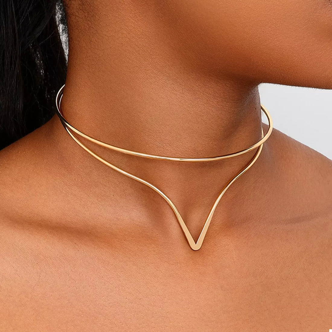 Golden V-shaped double layer choker necklace with a dainty design