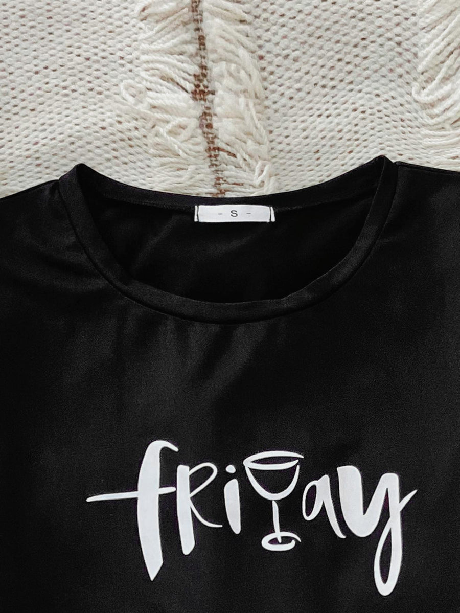 Black graphic tee with white "friday" text and wine glass graphic, crew neck, short sleeve.