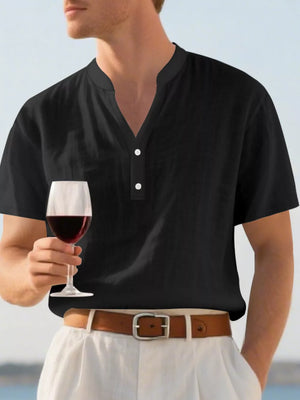 Black relaxed-fit men's short sleeve overshirt with band collar and button detail.