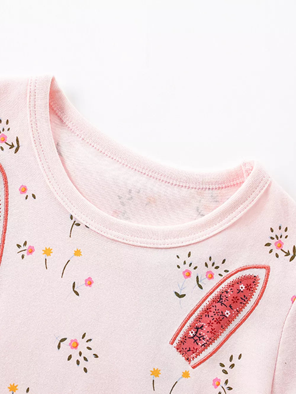 Pink cotton toddler dress with floral print and bunny ear detail