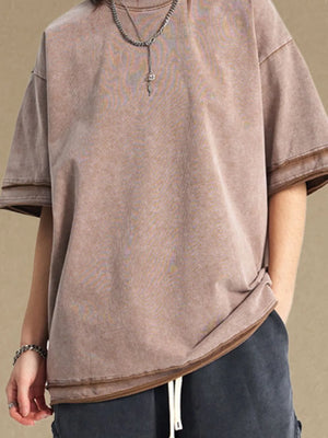 Washed cotton tee in mocha with raw edge details and a relaxed fit.
