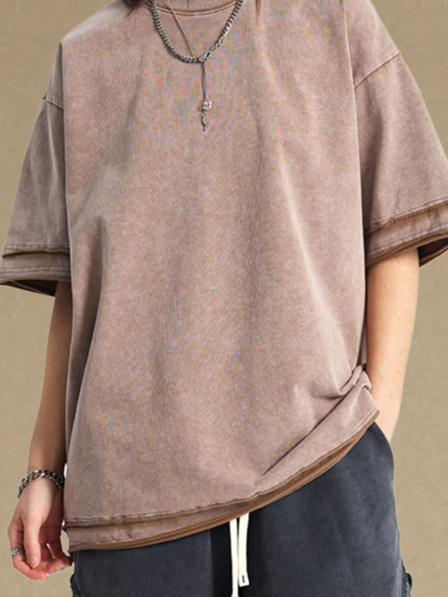 Washed cotton tee in mocha with raw edge details and a relaxed fit.