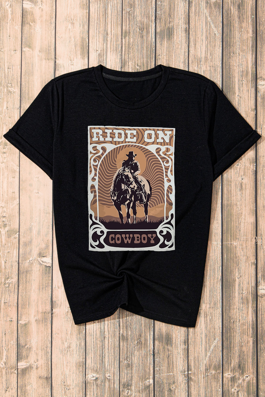 Black graphic t-shirt with a cowboy riding a horse and the words Ride On Cowboy.