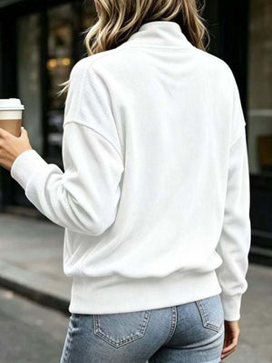 Burgundy sweatshirt featuring buttoned and ribbed knit