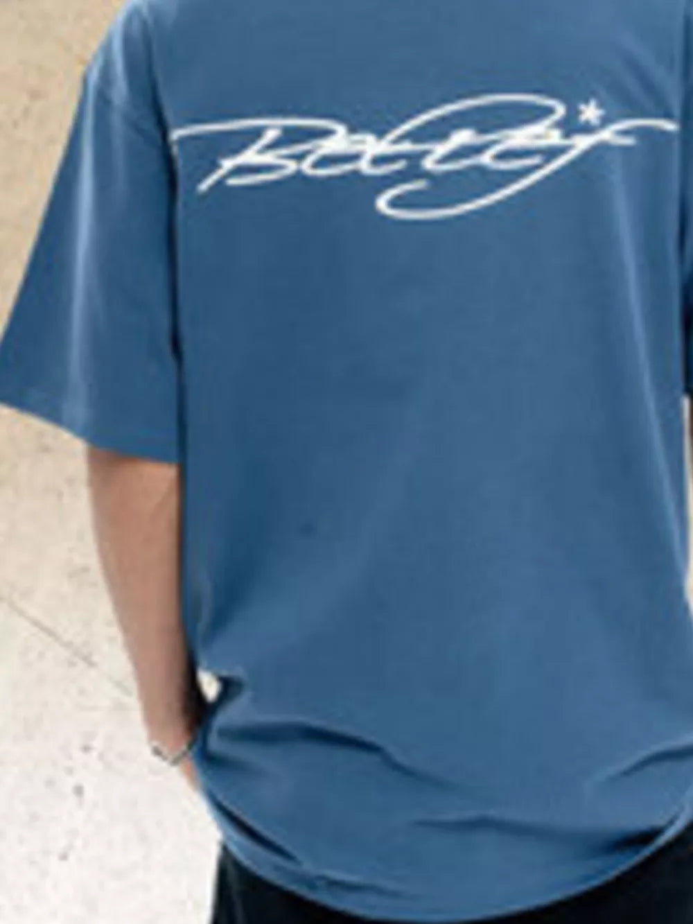 Cerulean crew neck t-shirt with white graphic print on back