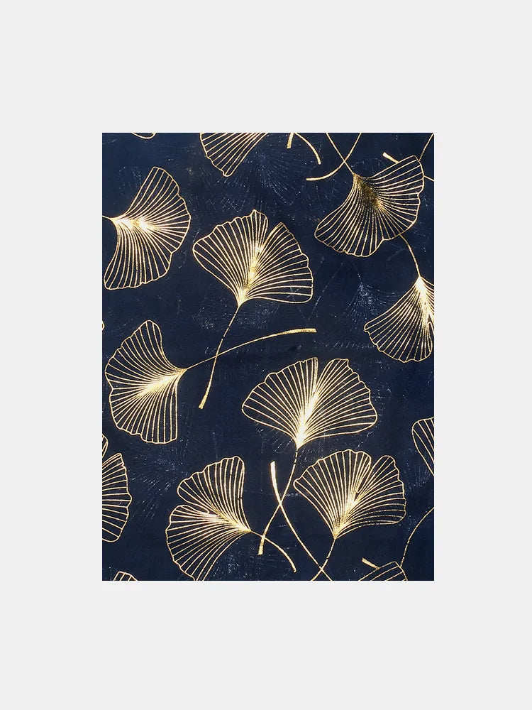 Gilded ginkgo leaf scarf in dark navy with gold metallic print.