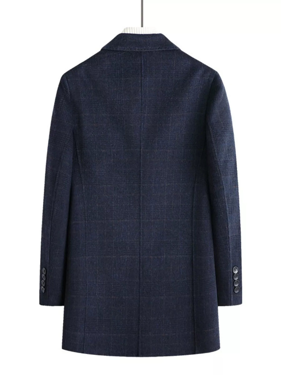 Men's navy plaid wool blend overcoat with buttoned cuffs.