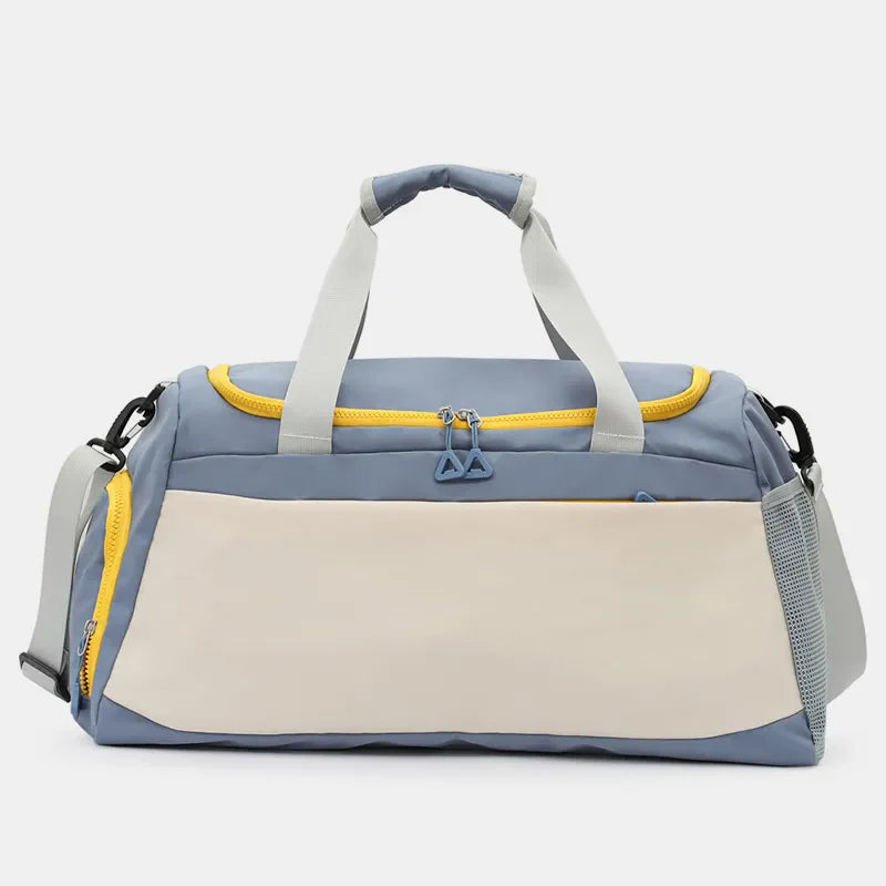 Colorblock gym duffel bag in dusty blue and beige with yellow accents and mesh side pocket.