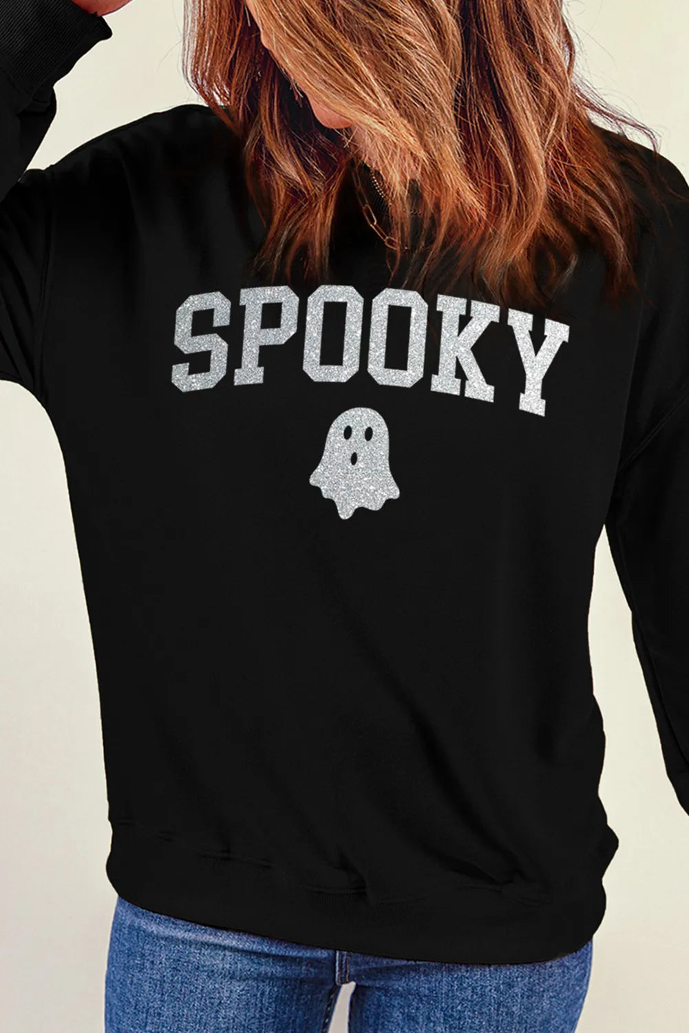 Black sweatshirt with glitter "Spooky" graphic and ghost detail