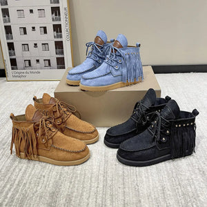 Fringed denim moc-toe ankle boots in blue, brown, and black with lace-up closure.