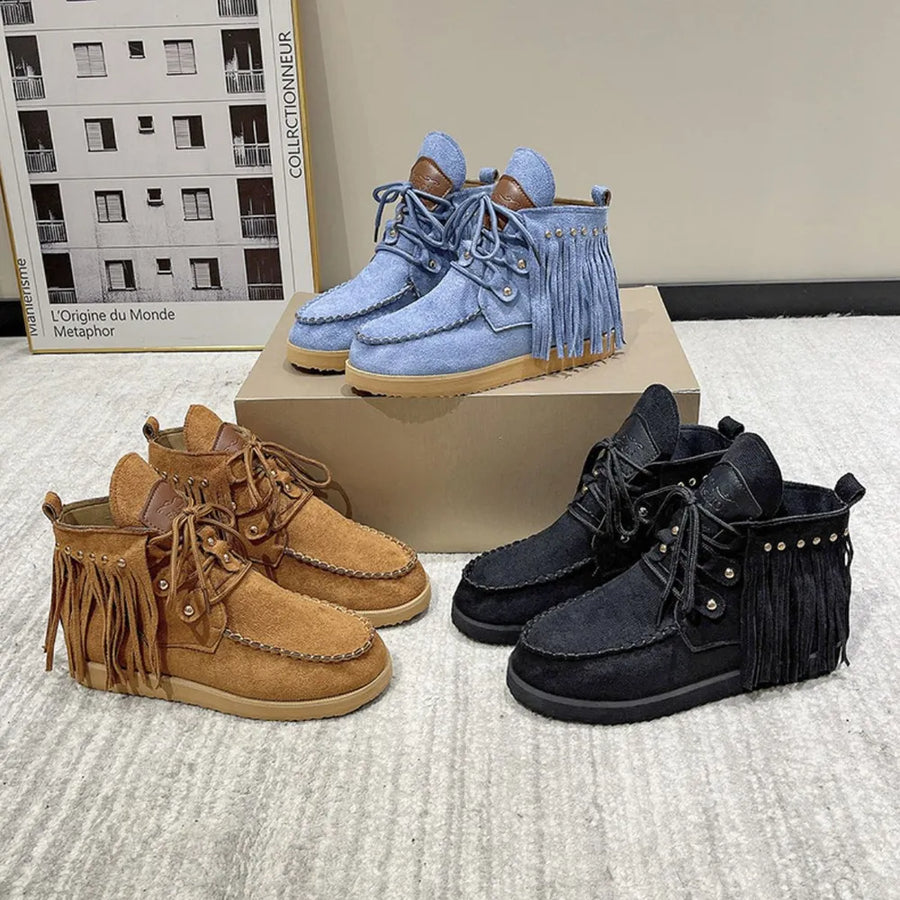 Fringed denim moc-toe ankle boots in blue, brown, and black with lace-up closure.