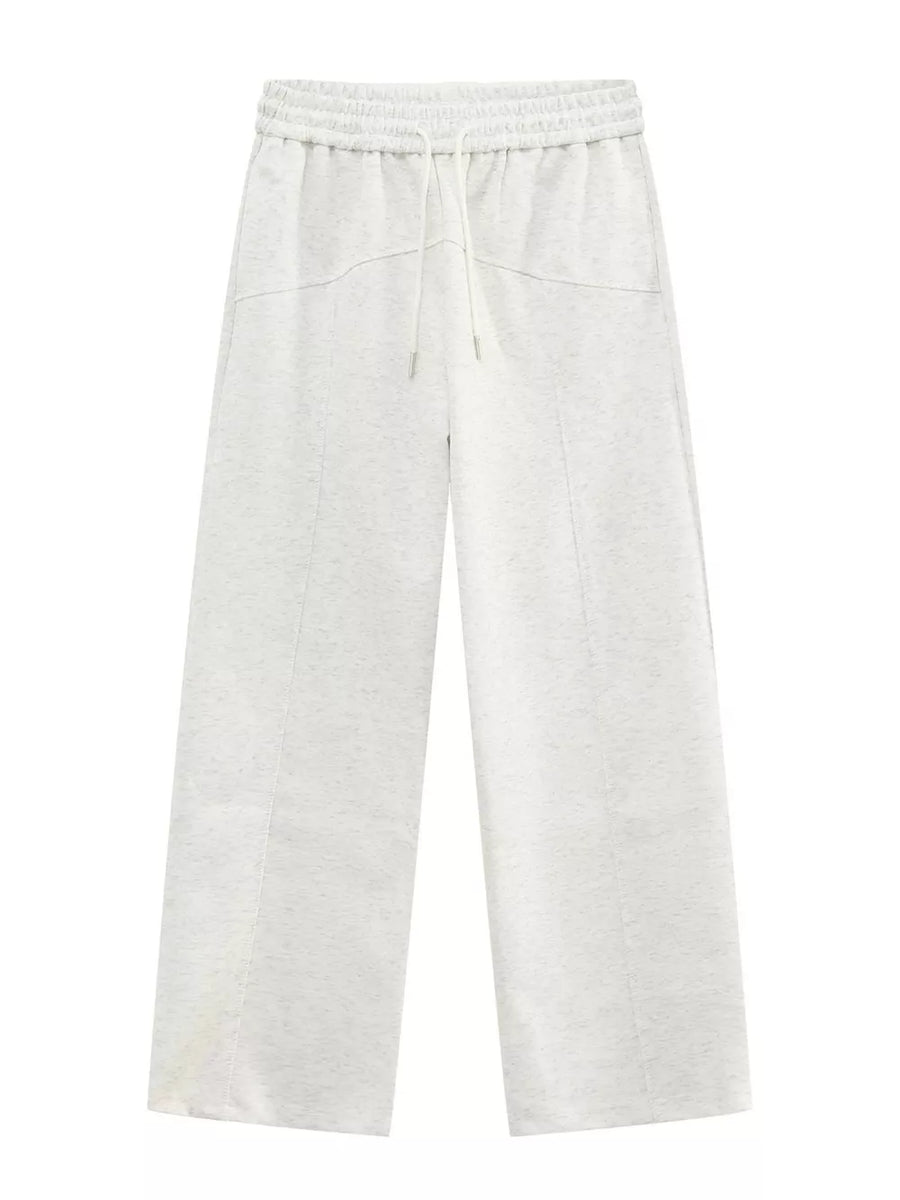 Cream cotton drawstring sweatpants with wide legs and tailored seams.