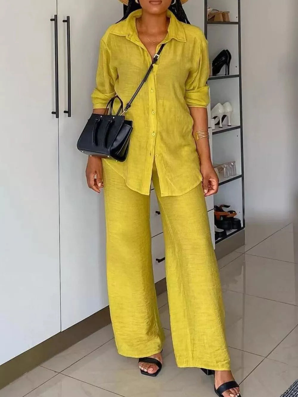 Lemon yellow collared button-down shirt and wide-leg pants set with rolled sleeves.