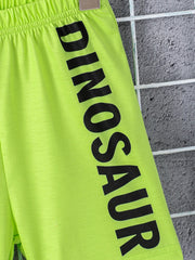 Neon green toddler shorts with black dinosaur text and elastic waistband.