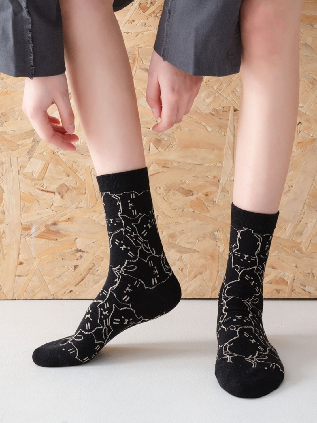 socks in black featuring ribbed cuff and fitted fit