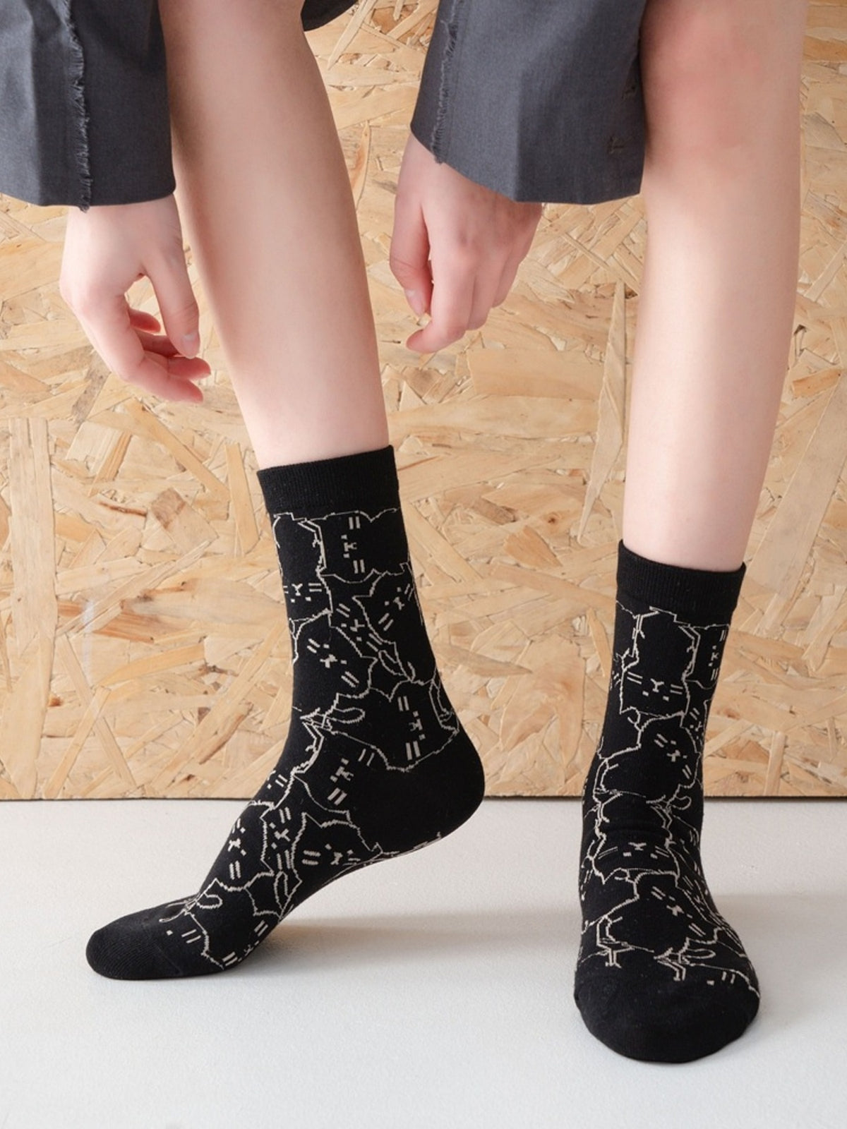 socks in black featuring ribbed cuff and fitted fit