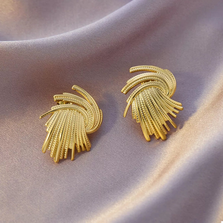 Textured 18K gold-plated stud earrings with a fan-like design and intricate detailing.