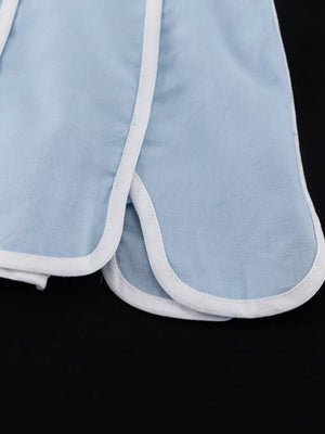 Light blue cotton shorts with white piping and curved hem