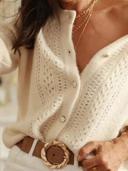 Cream eyelet knit button-down cardigan with pearl buttons, styled with a brown belt.
