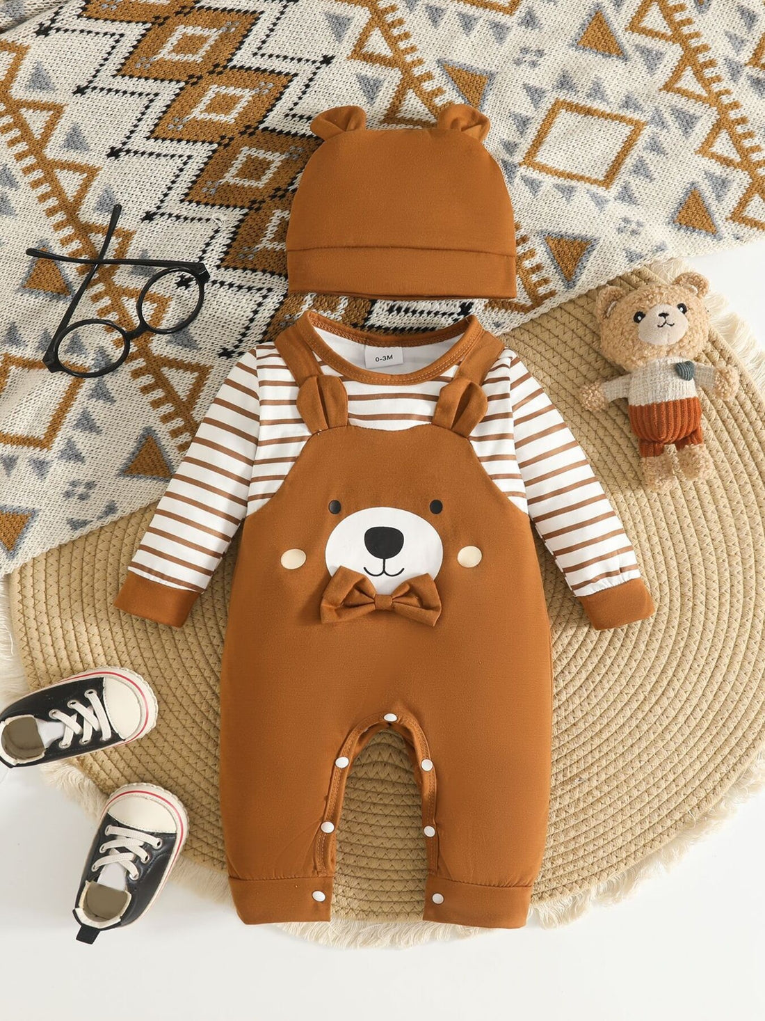 caramel brown jumpsuit with bear pattern and round neck