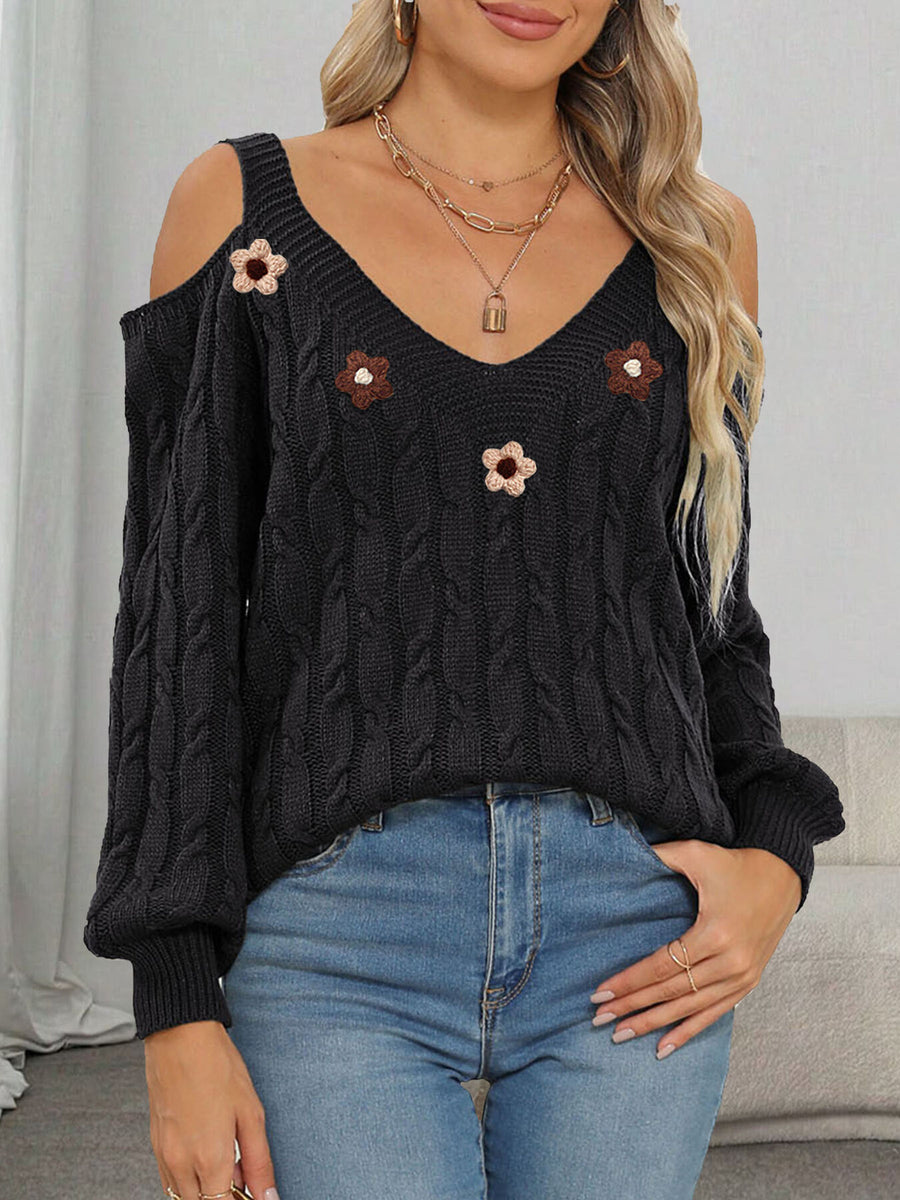 black pullover sweater with cable knit and v-neck