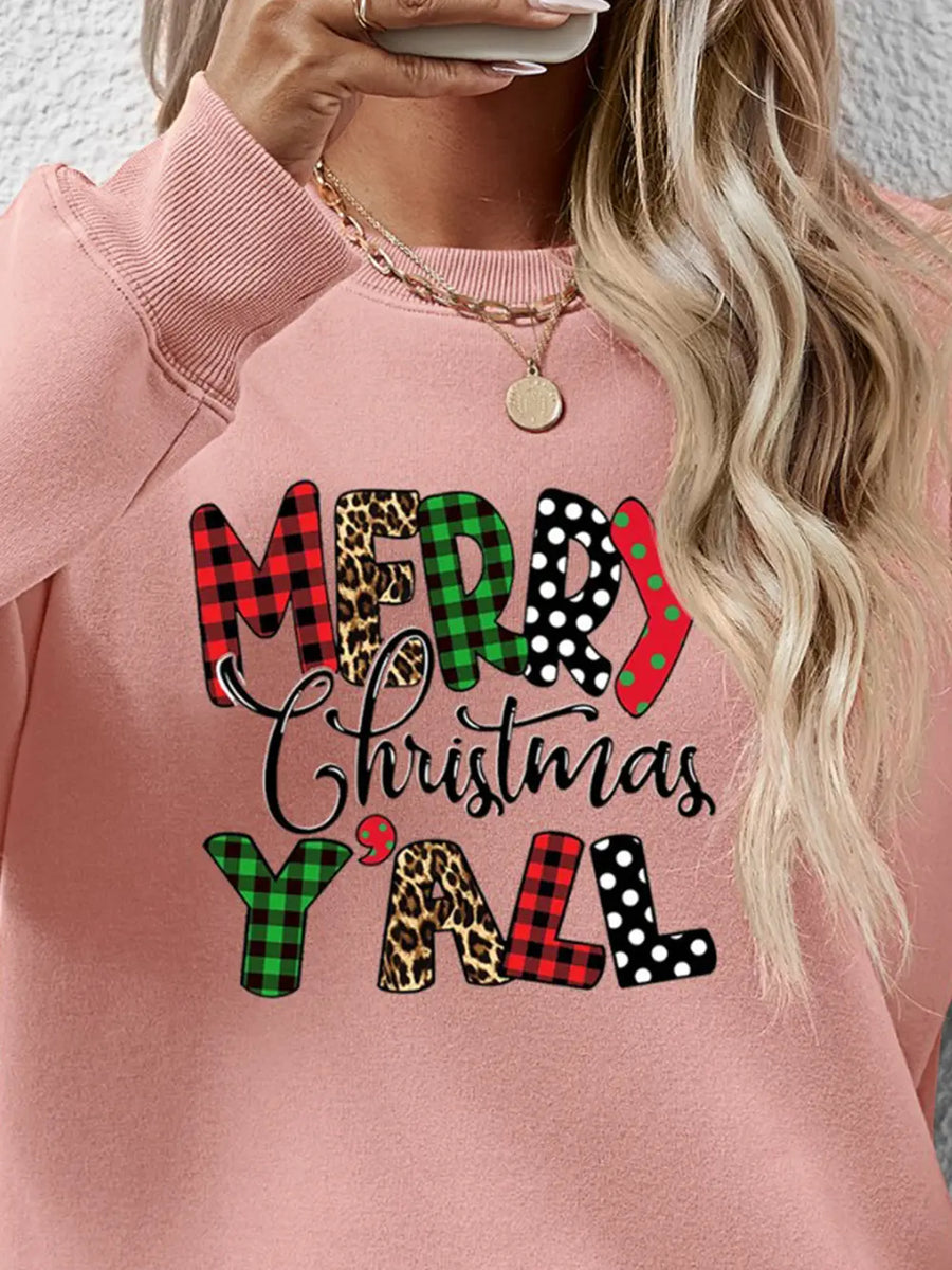 Blush pink crewneck sweatshirt with festive mixed print Merry Christmas Yall graphic.