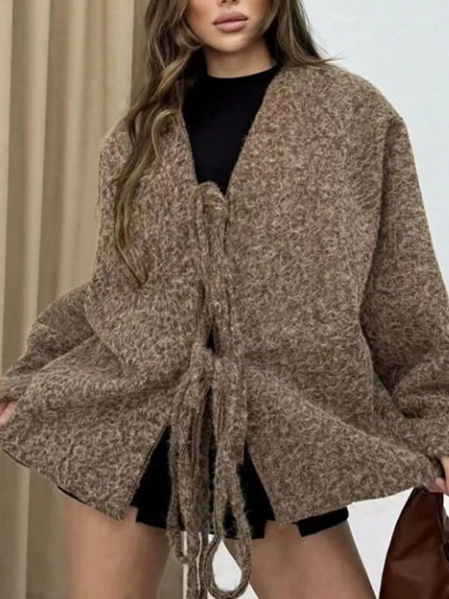 Textured knit tie-front cardigan in dark brown with a relaxed fit and open front.