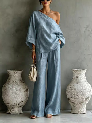 Black two-piece set with one-shoulder and elbow sleeve