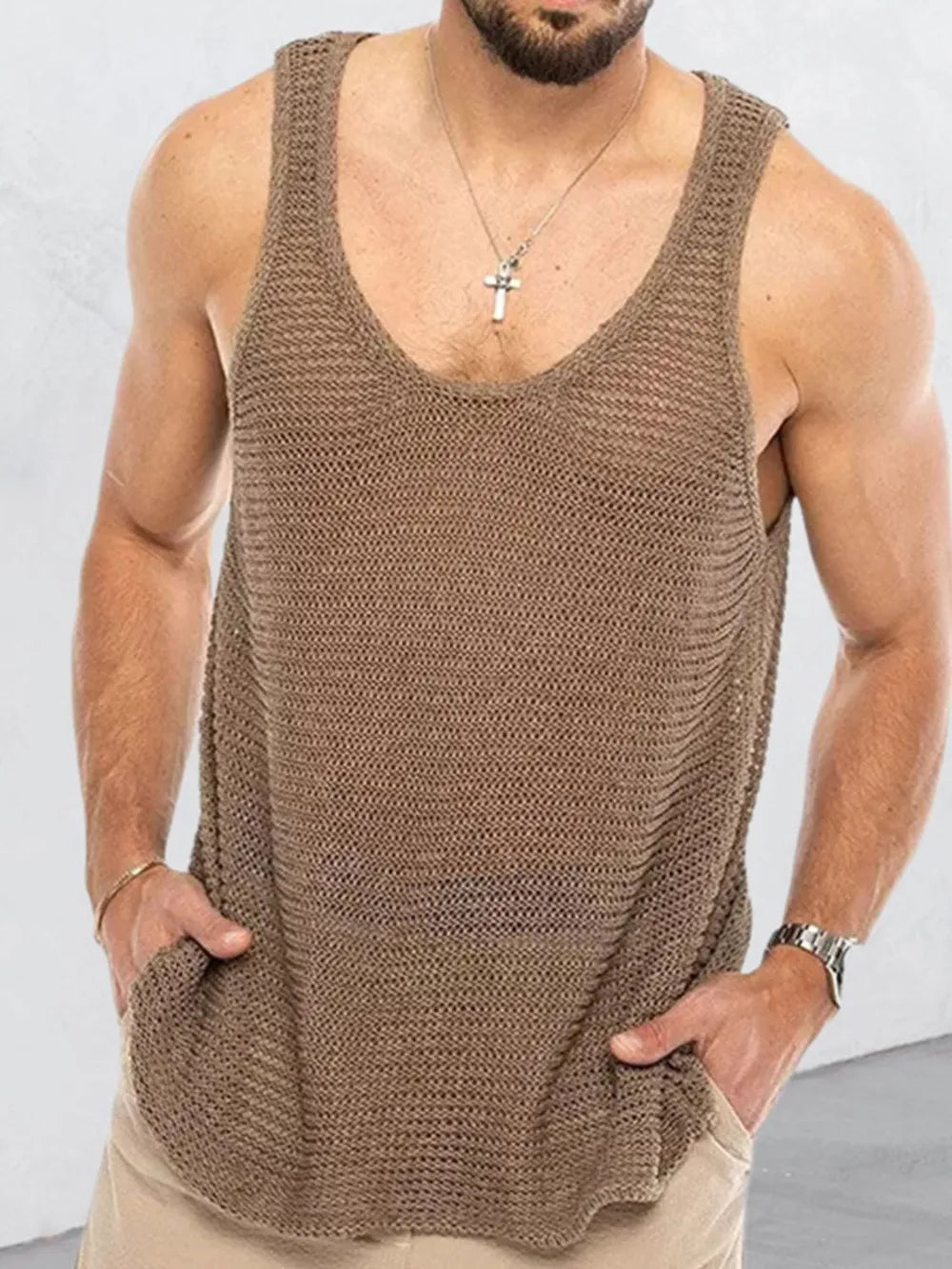 Open-knit taupe scoop neck tank top with pockets worn by a man.