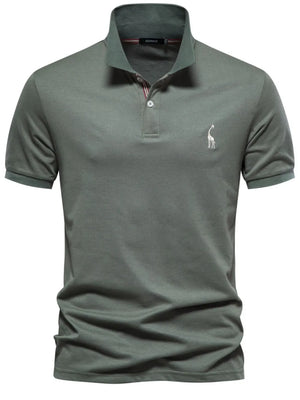 Moss green piqué polo shirt with giraffe embroidery and striped collar detail.