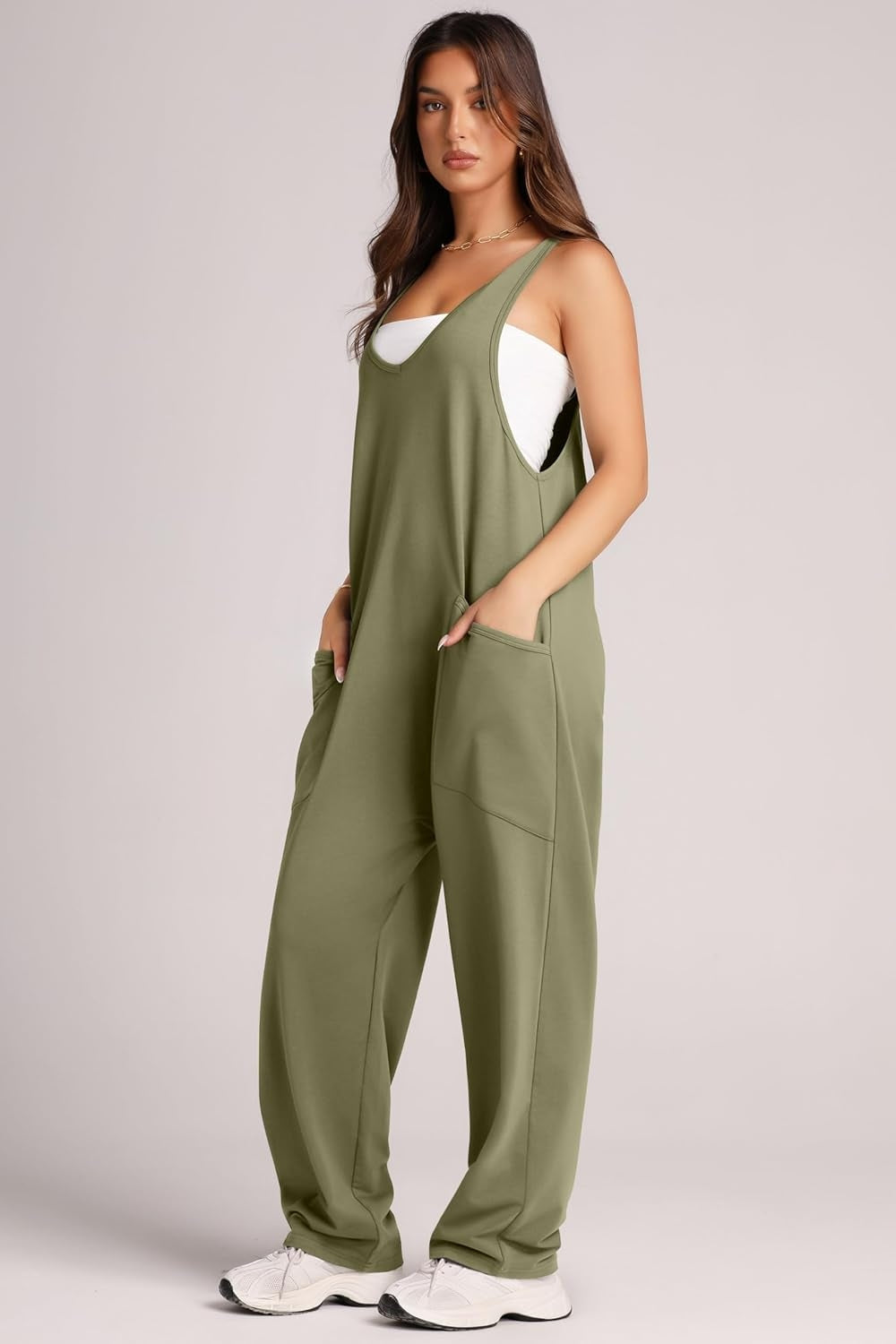 Relaxed fit jumpsuit in Matcha Green with oversized pockets and V-neck.