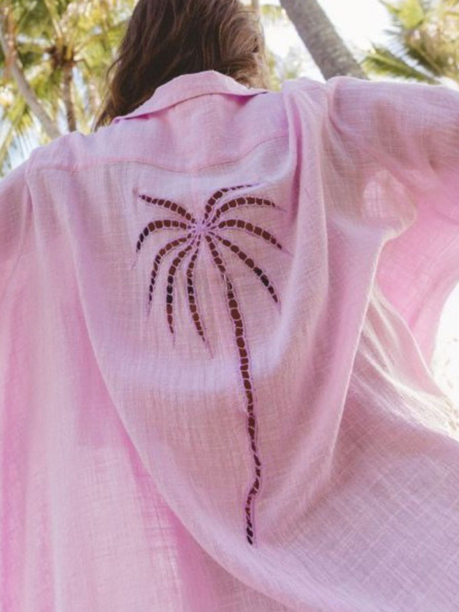 Pink cotton blend button-down shirt dress with a palm tree cutout detail on the back.
