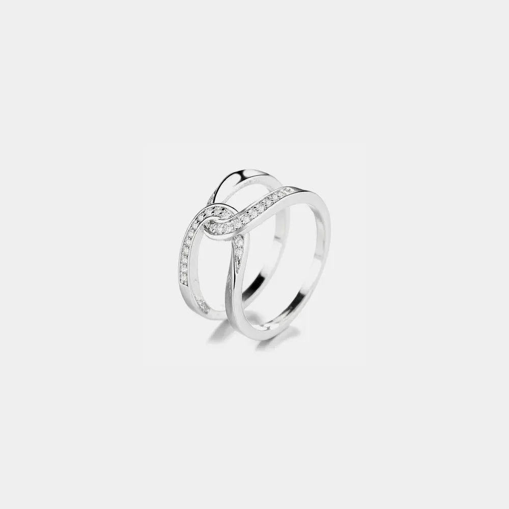 Silver intertwined pavé band ring with cubic zirconia accents
